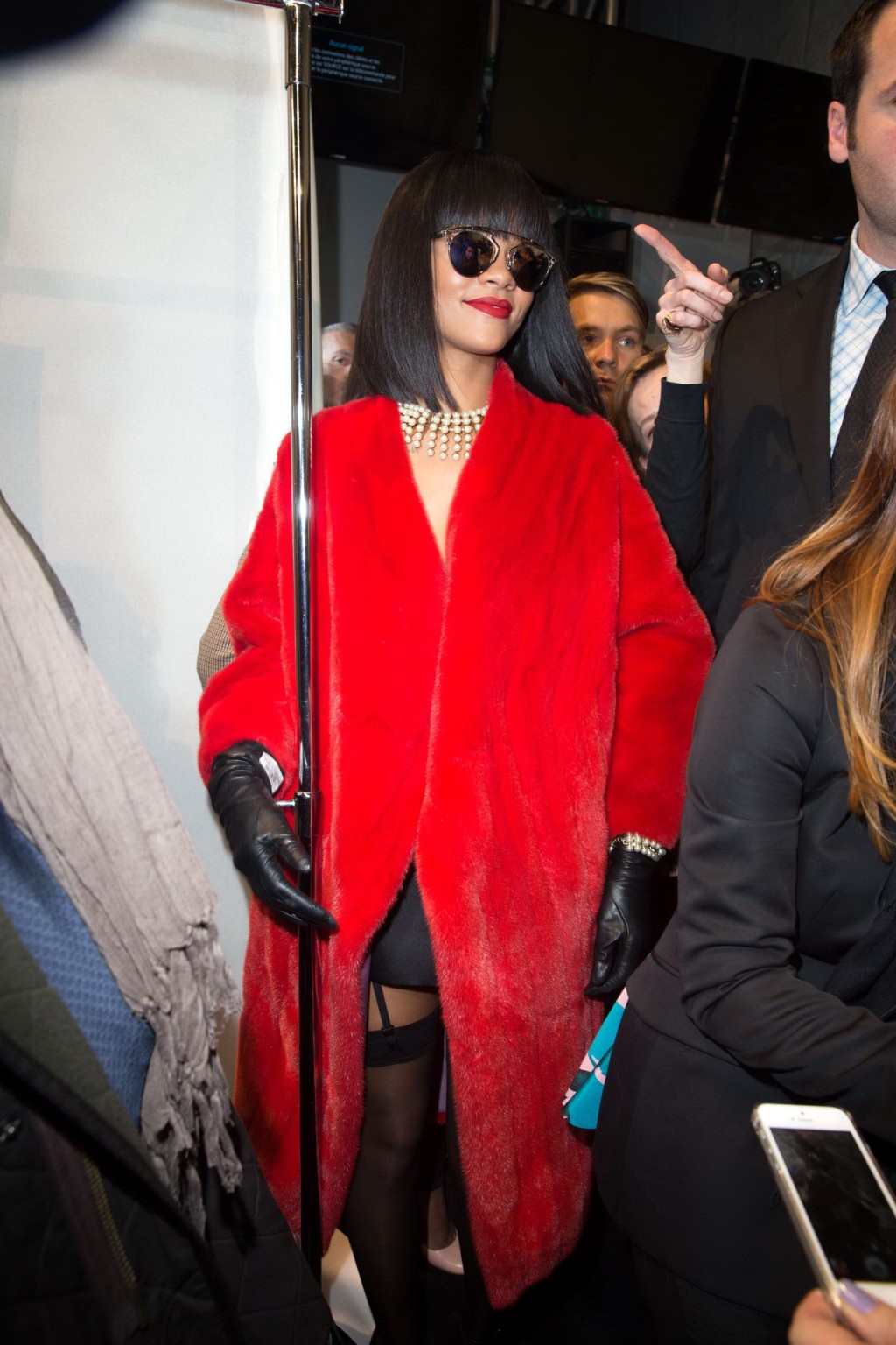 Rihanna showing off her stockings and cleavage at the Christian Dior fashion sho #75203606