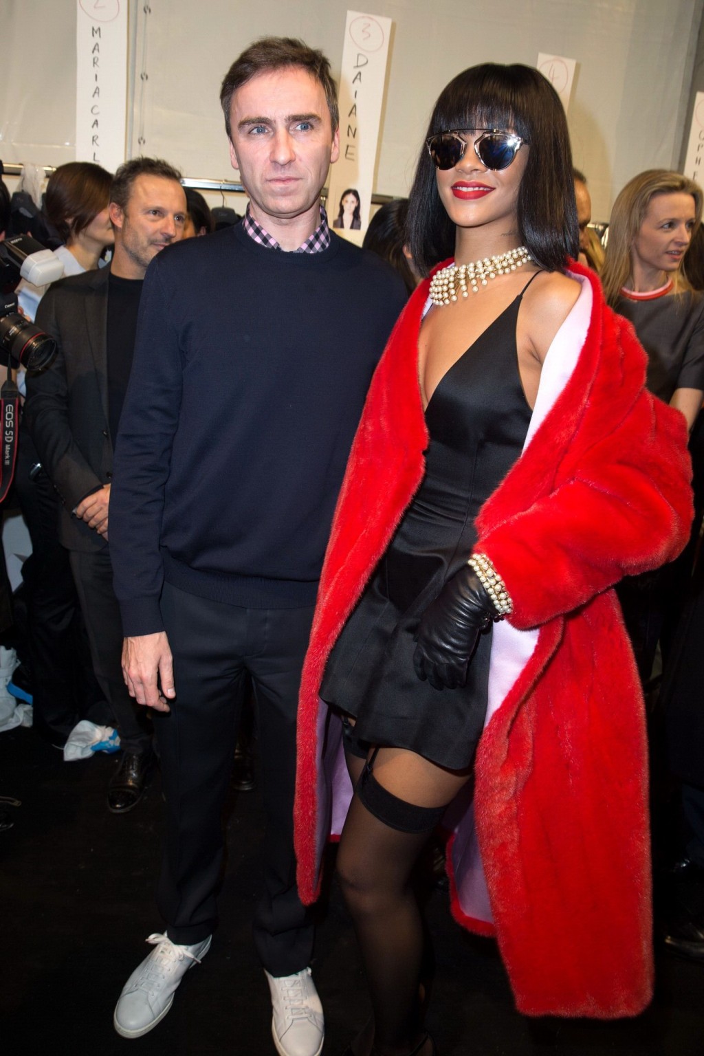 Rihanna showing off her stockings and cleavage at the Christian Dior fashion sho #75203614