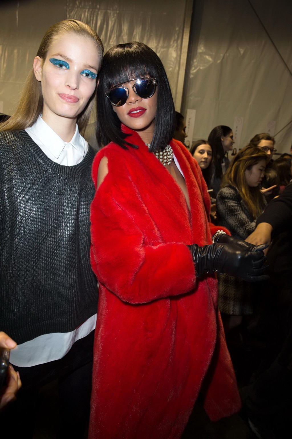 Rihanna showing off her stockings and cleavage at the Christian Dior fashion sho #75203663