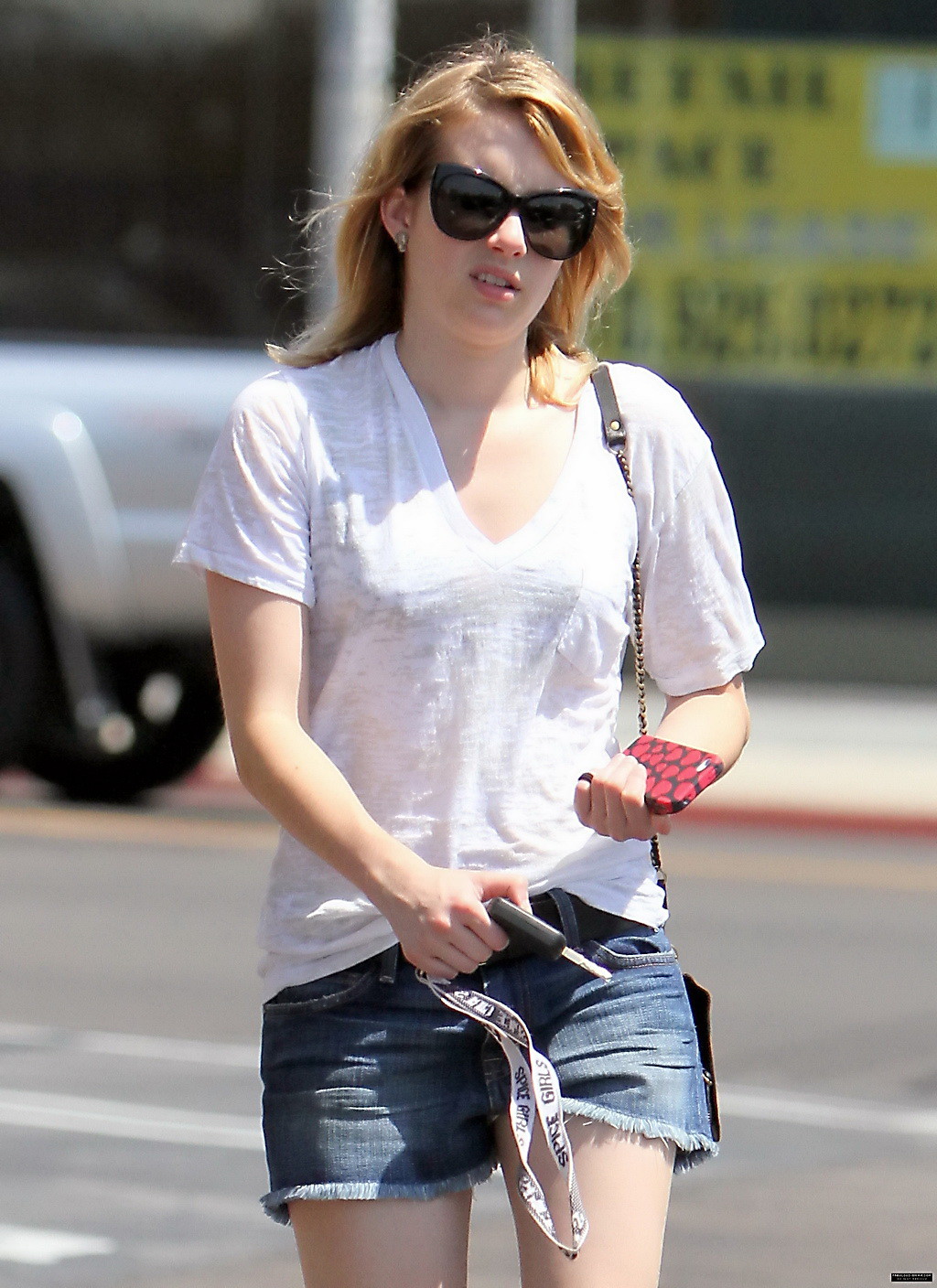 Emma Roberts wearing see-through to bra and denim shorts at the gas station in W #75253814