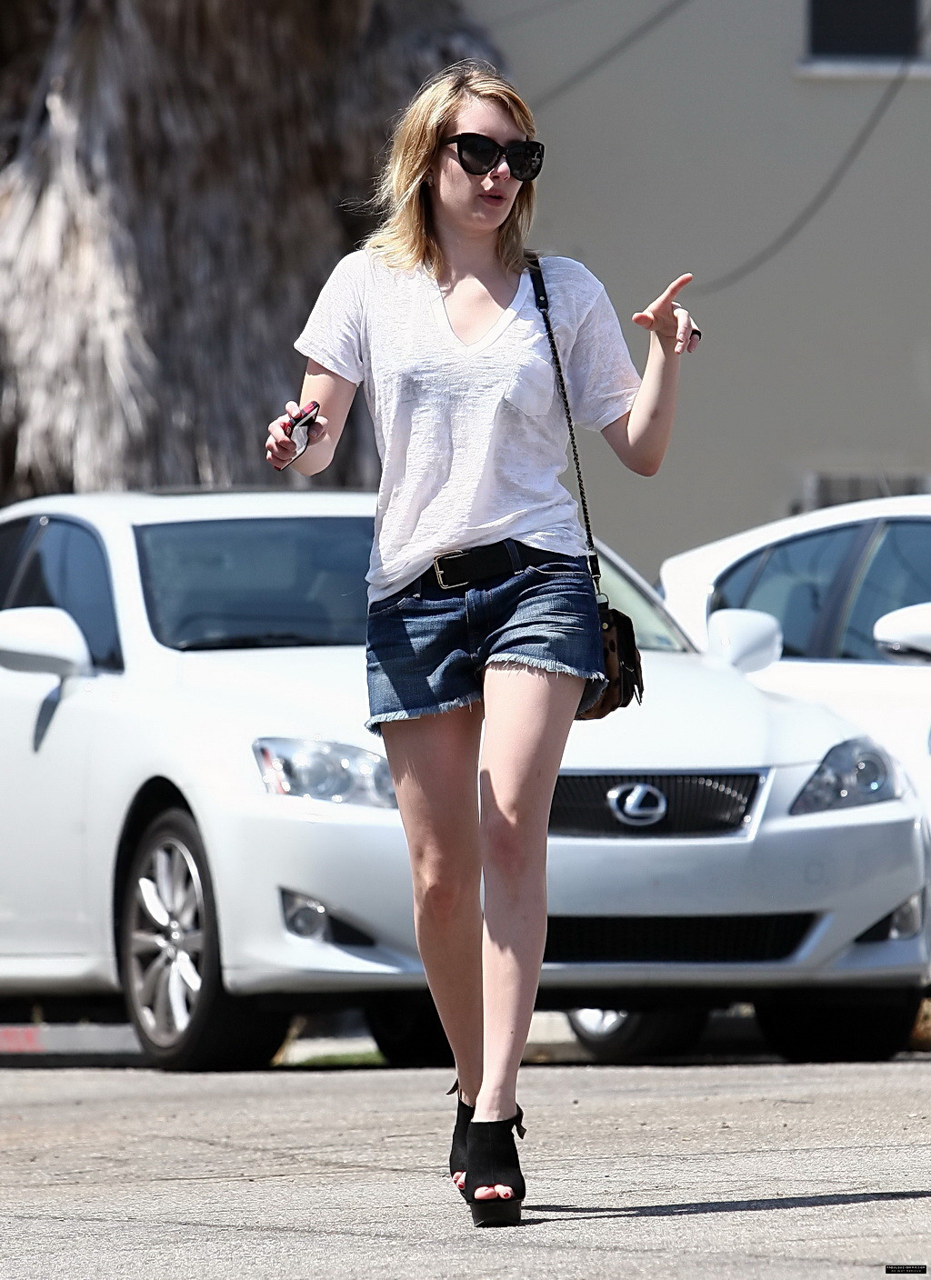 Emma Roberts wearing see-through to bra and denim shorts at the gas station in W #75253826
