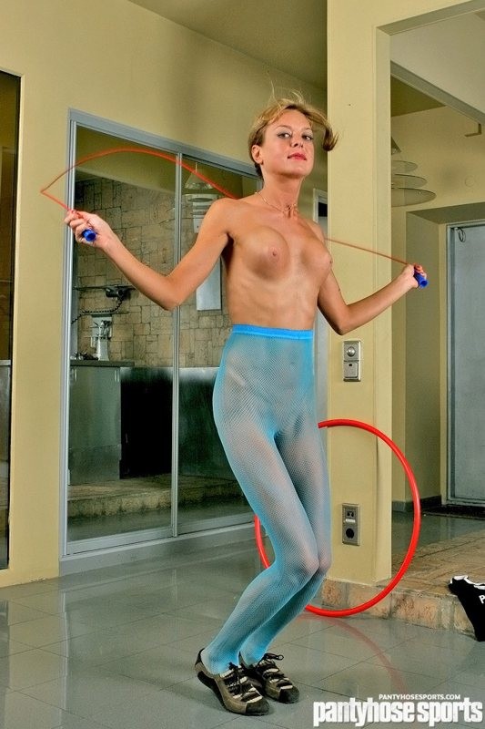 Girl in blue fishnet tights exercises #71594291