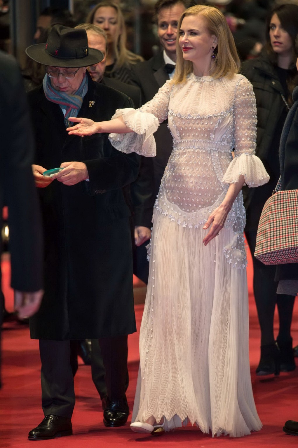 Nicole Kidman wearing bizare white seethru lace smock at Queen of the Desert pre