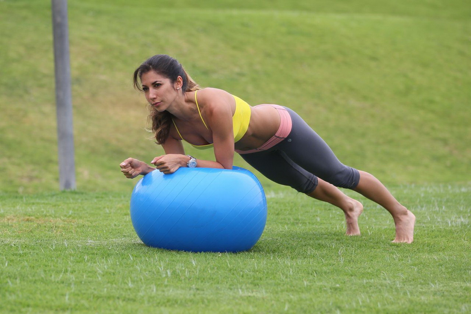 Leilani Dowding practicing yoga in a sports bra and leggings at the park in LA #75201915