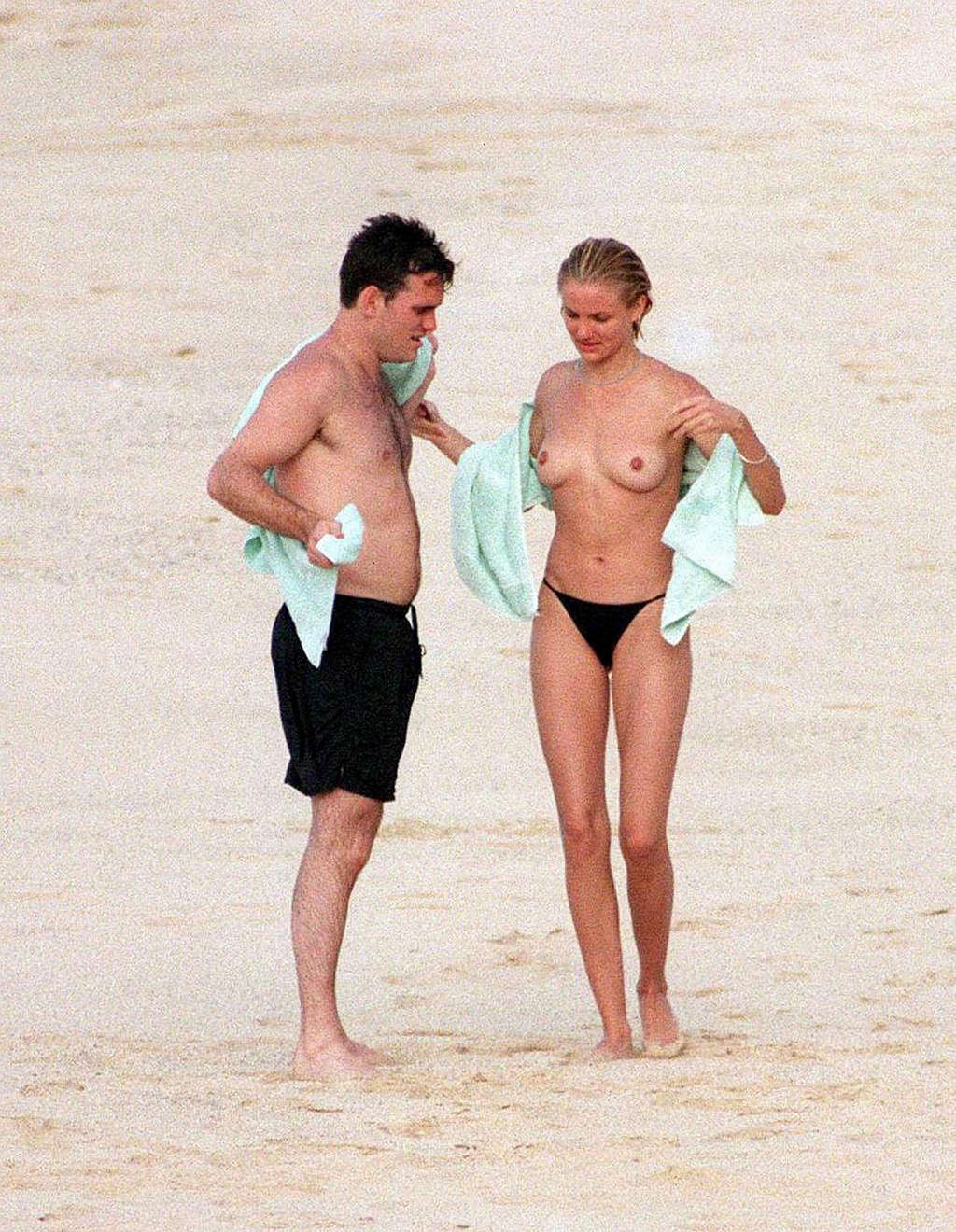 Cameron Diaz showing her sexy legs and nude boobs on beach #75356589