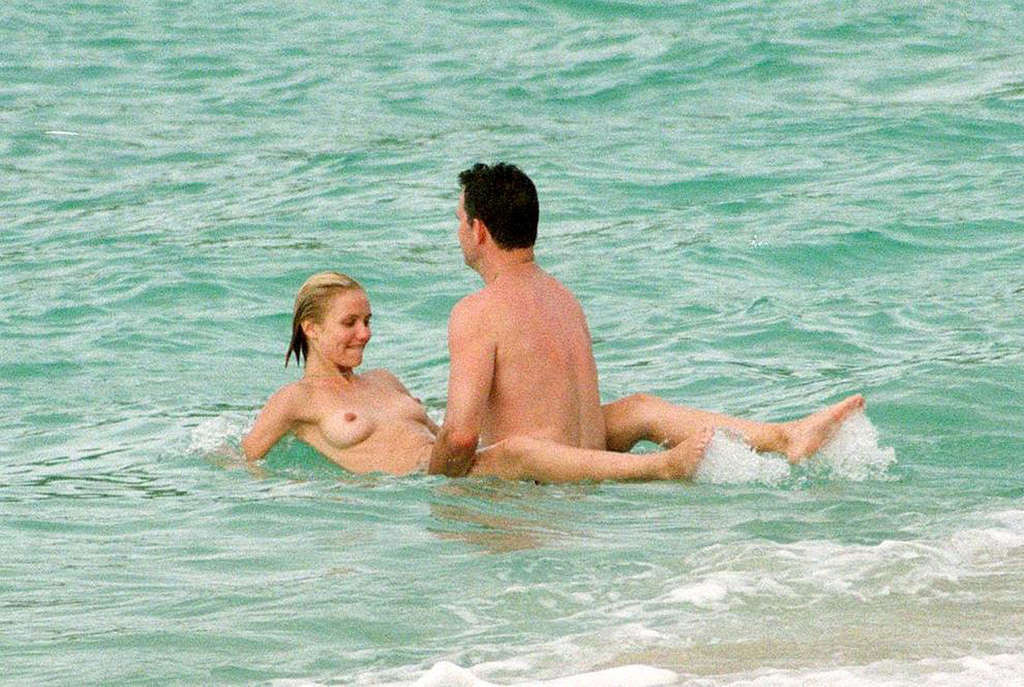 Cameron Diaz showing her sexy legs and nude boobs on beach #75356615