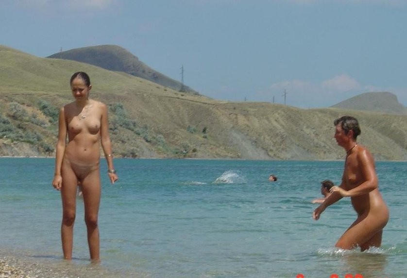 These two teen nudists play frisbee in the water #72253520