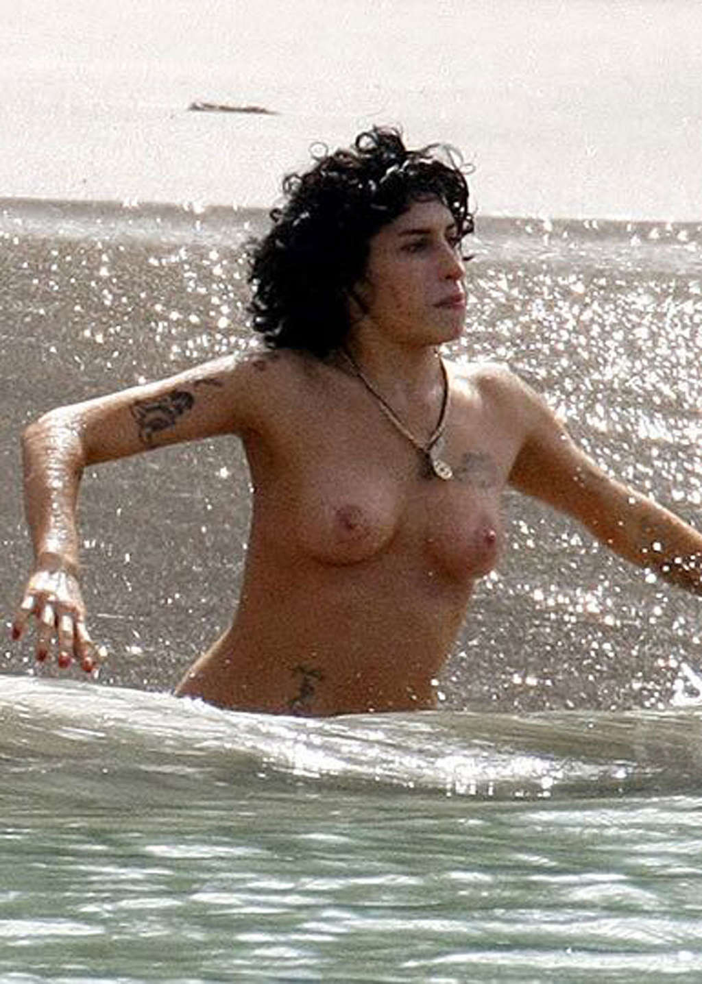 Amy Winehouse upskirt and nipple slip in car and showing her tits on beach papar #75337879