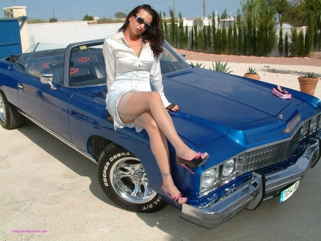 Retro Trinity posing in stockings with vintage car #74857791