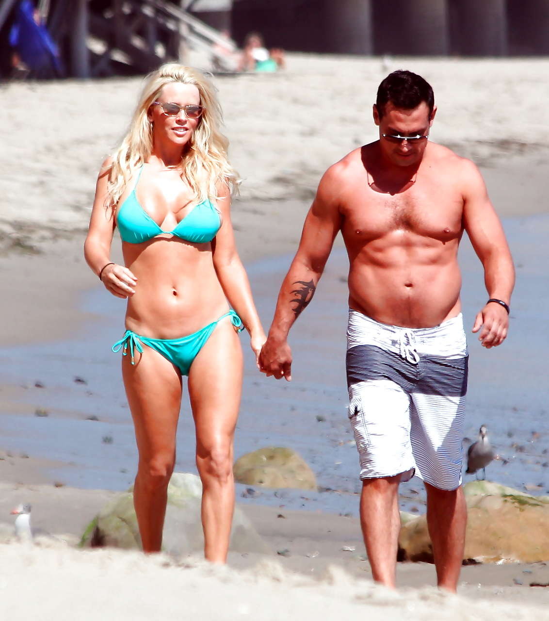 Jenny McCarthy looking very cute and sexy in green bikini on beach #75288655