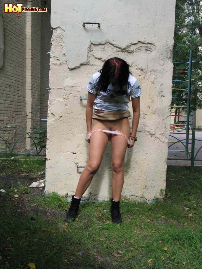 Girl pissing outside #76593785