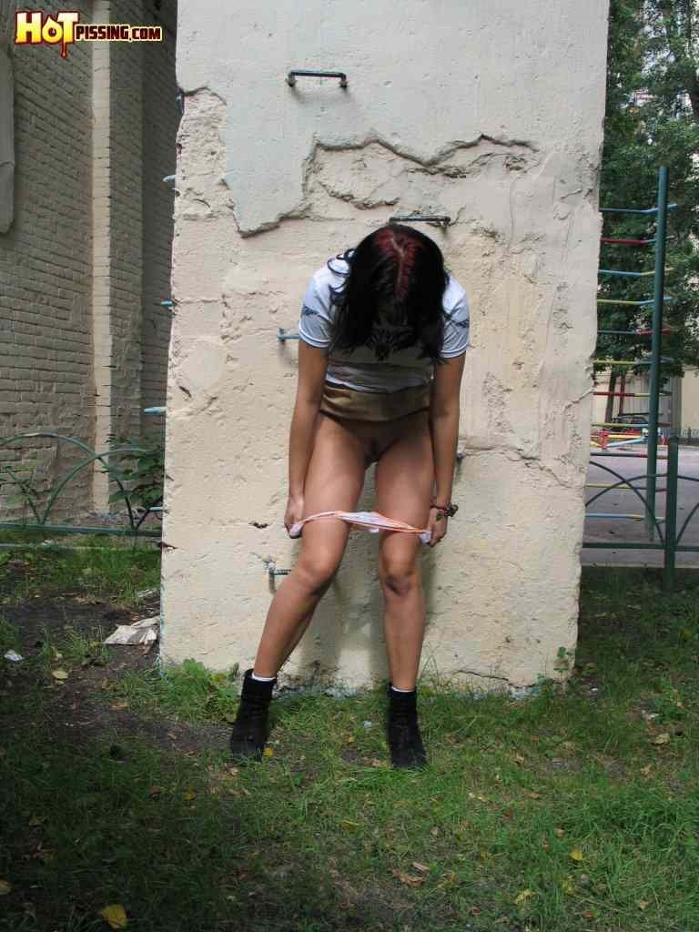 Girl pissing outside #76593794