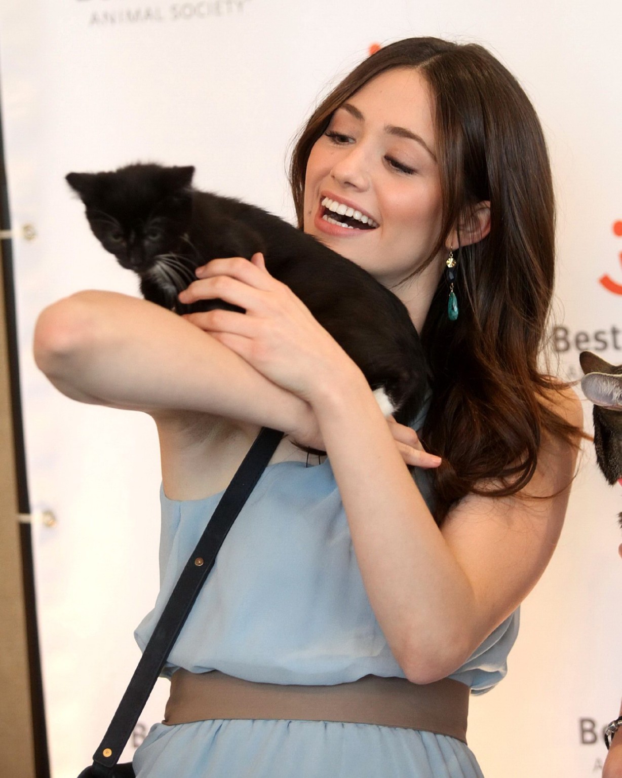Emmy Rossum petting a kitty at Best Friends Animal Society Acatemy Awards in Los #75316942
