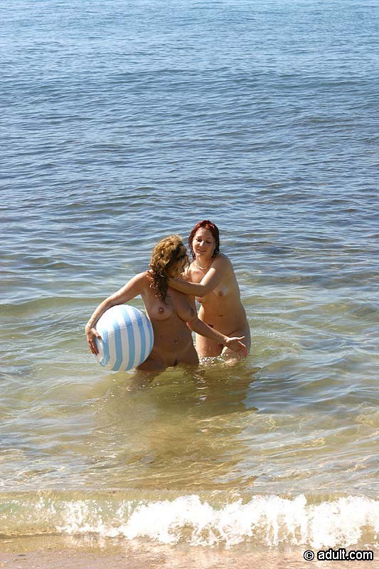 Beautiful nudist lesbians having a foursome on a sunny beach #72319237