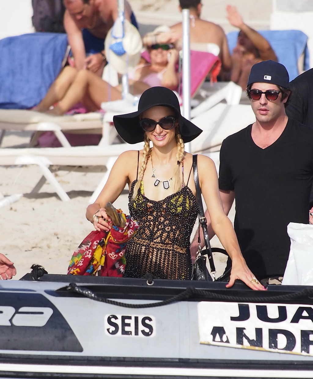 Paris Hilton wearing seethru to bikini preparing to ride jet ski on the beach in #75257599