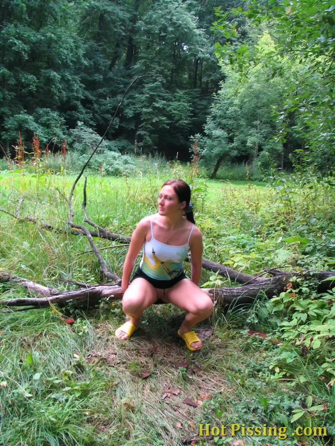 Horny chickie pulls up her skirt and enjoys taking a piss on the glade #76571822