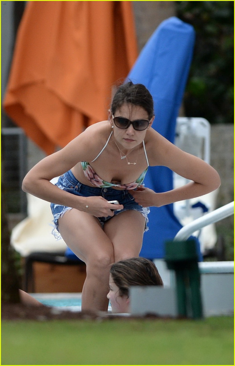 Katie Holmes wearing a bikini top and denim shorts in Miami #75208597