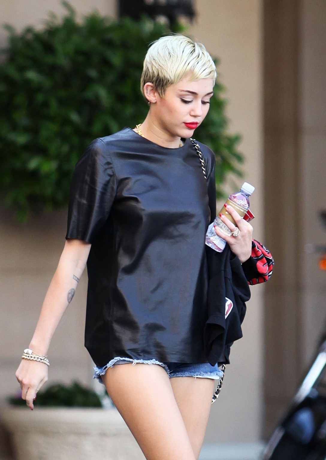 Miley Cyrus leggy wearing a denim shorts  a leather top out in Beverly Hills #75235251