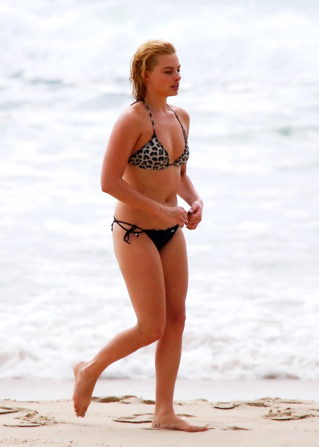 Margot Robbie showing off her bikini body at a beach in Byron Bay #75176993