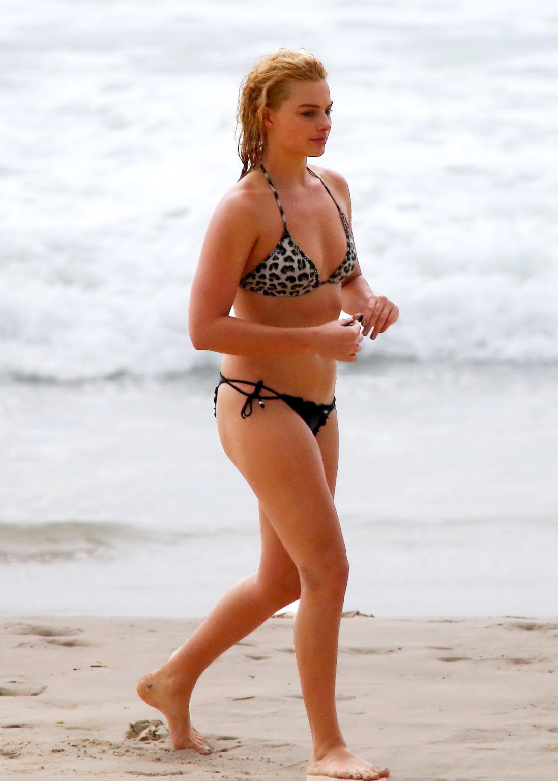 Margot Robbie showing off her bikini body at a beach in Byron Bay #75177009