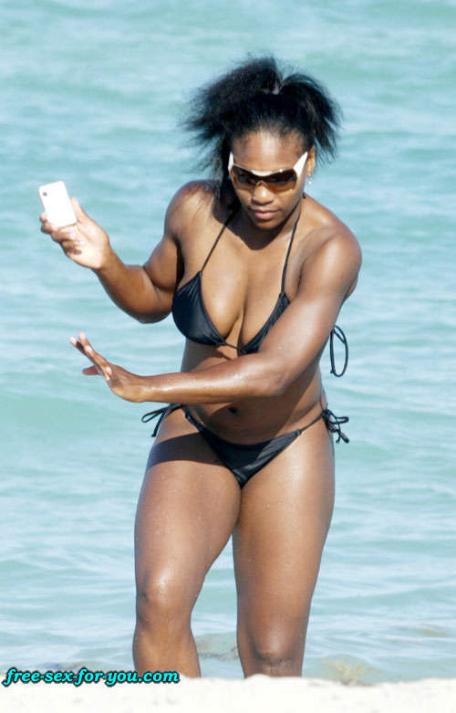 Serena Williams in black bikini on beach with her boyfriend #75433379