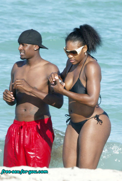 Serena Williams in black bikini on beach with her boyfriend #75433397