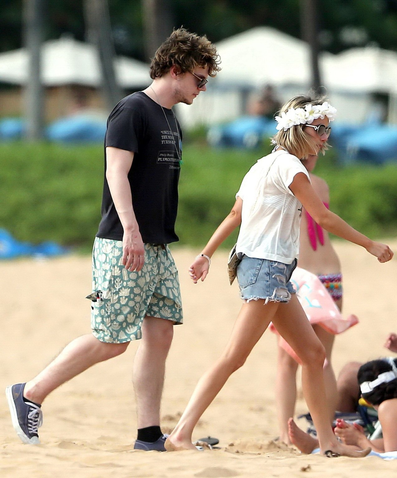 Emma Roberts wearing bikini top and shorts on a beach in Maui #75194872