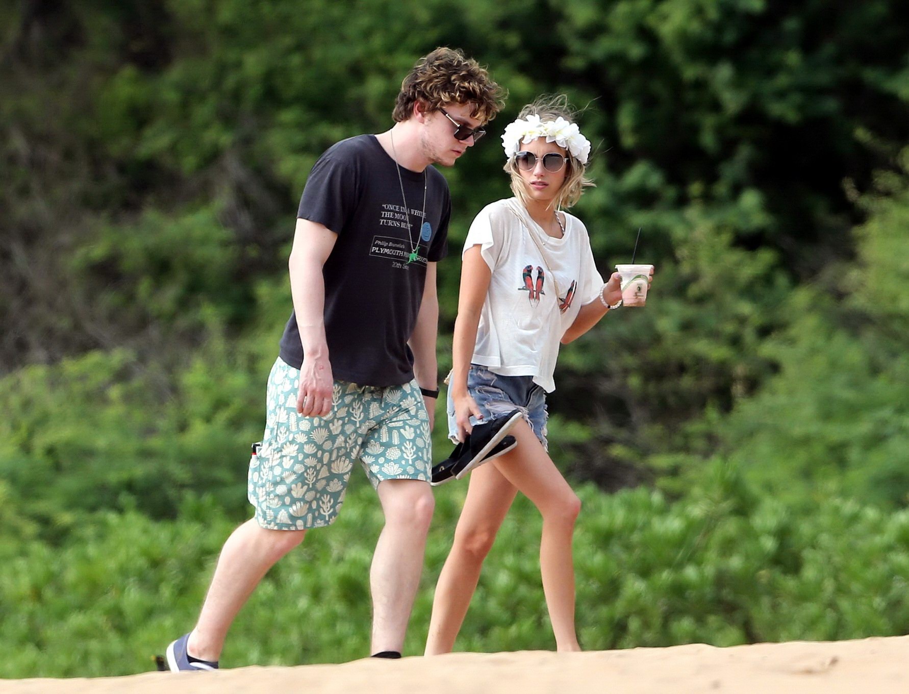Emma Roberts wearing bikini top and shorts on a beach in Maui #75194900