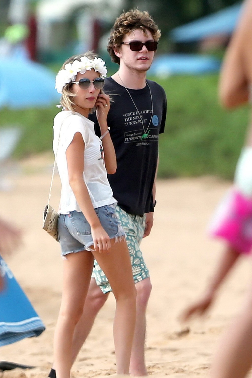 Emma Roberts wearing bikini top and shorts on a beach in Maui #75194933