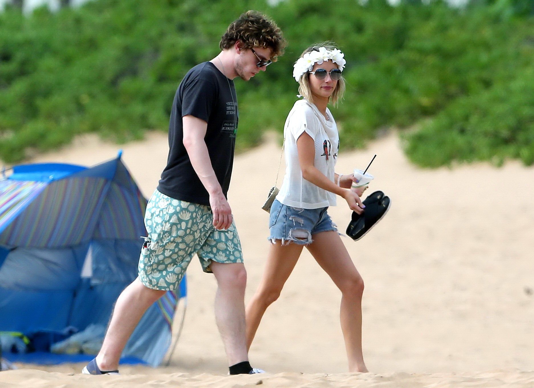 Emma Roberts wearing bikini top and shorts on a beach in Maui #75194942