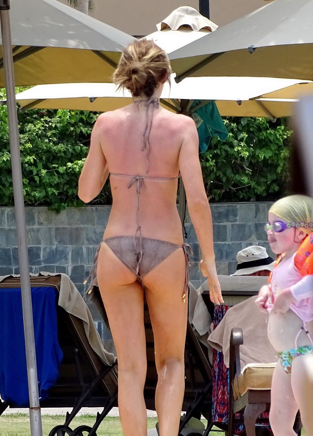 Abigail Clancy shows underboob wearing a skimpy snake print bikini at the pool i #75195096
