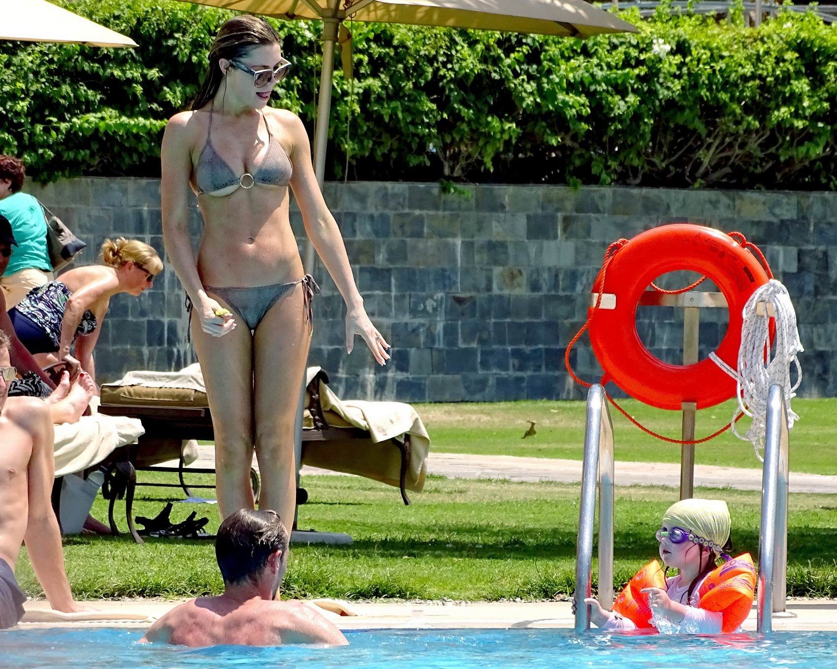 Abigail Clancy shows underboob wearing a skimpy snake print bikini at the pool i #75195113