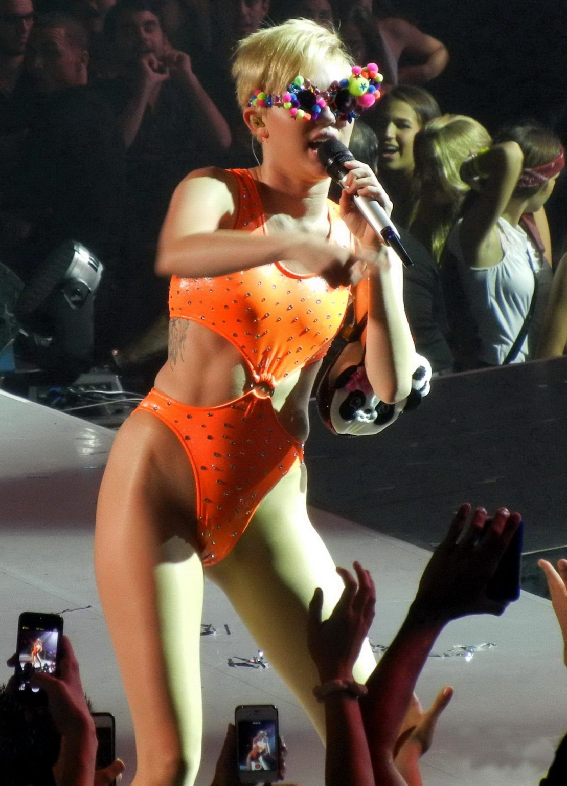 Miley Cyrus in an orange swimsuit performing at Bangerz Tour in San Juan Puerto  #75185737