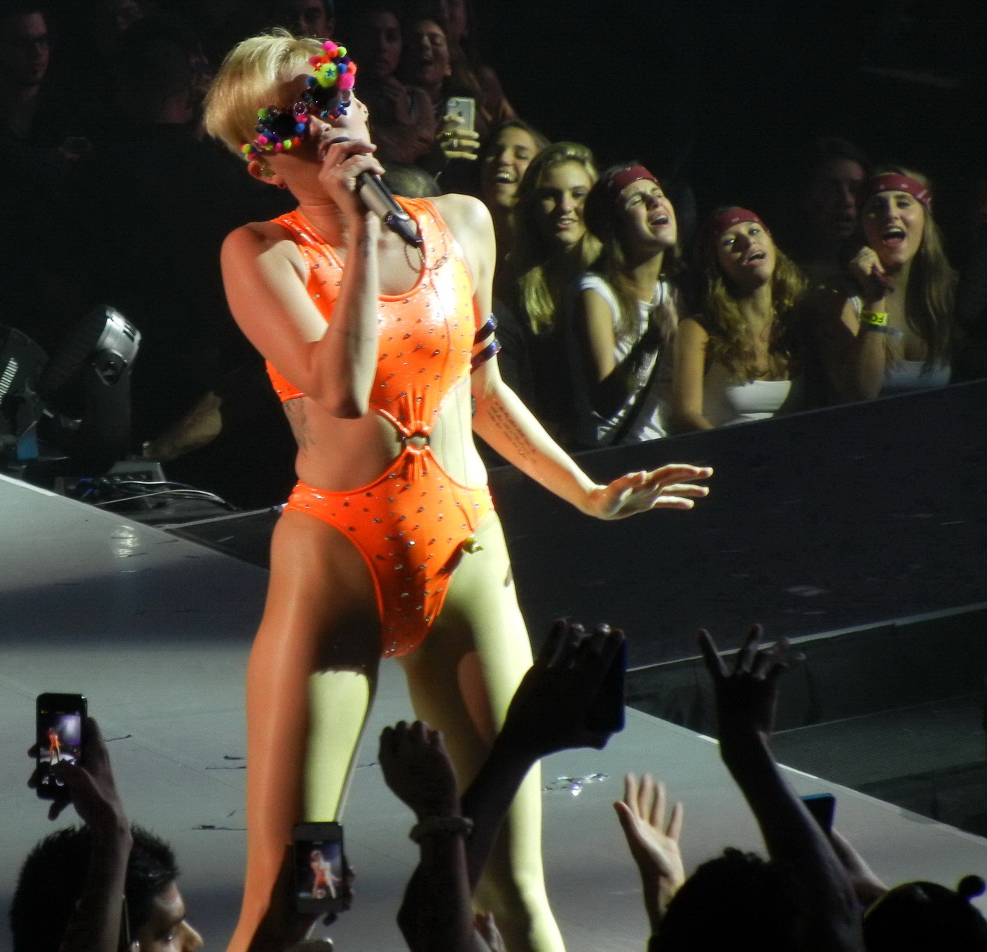 Miley Cyrus in an orange swimsuit performing at Bangerz Tour in San Juan Puerto  #75185754