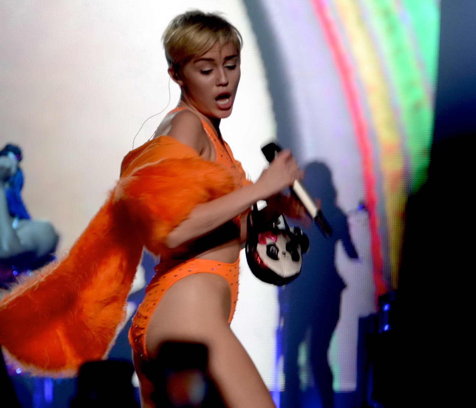 Miley Cyrus in an orange swimsuit performing at Bangerz Tour in San Juan Puerto  #75185794