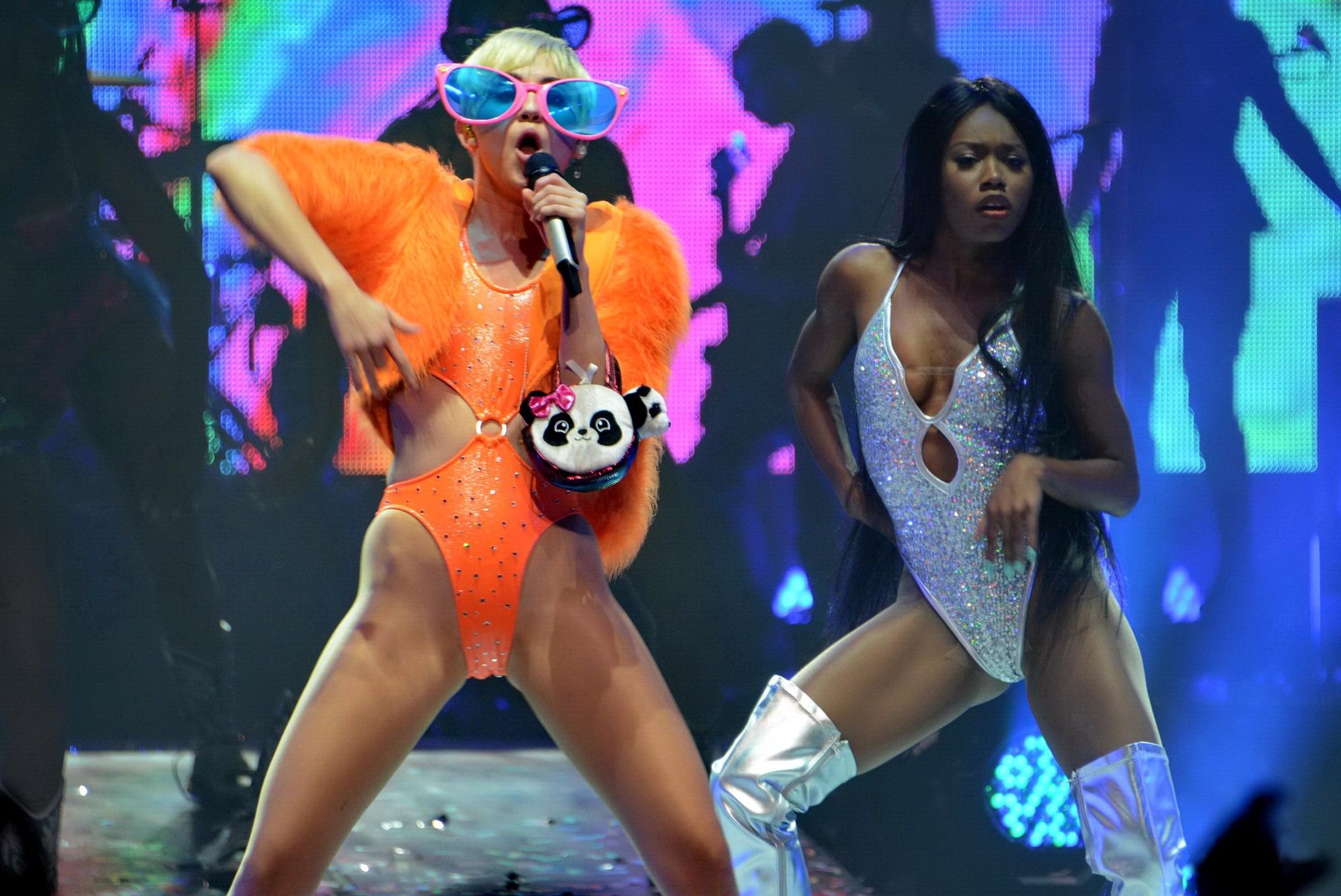 Miley Cyrus in an orange swimsuit performing at Bangerz Tour in San Juan Puerto  #75185836