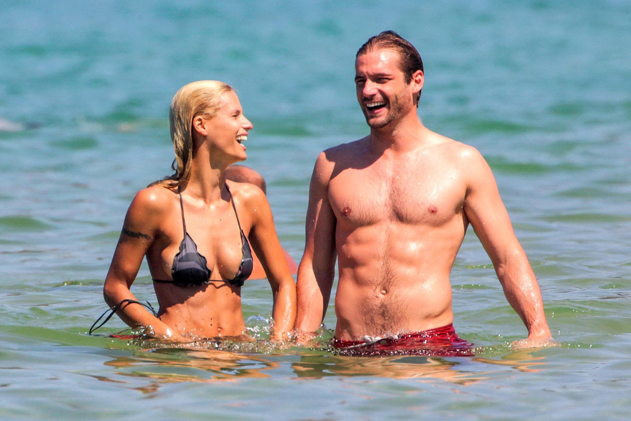 Michelle Hunziker in night camo bikini making out with her boyfriend on a beach  #75254172