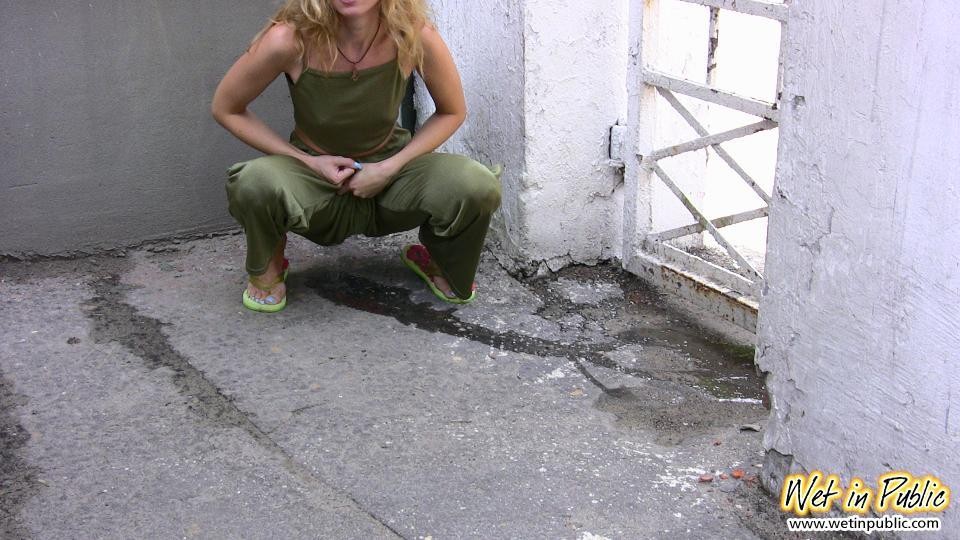 Blonde slim slut in green does a lil job right in the pants in public #78595346