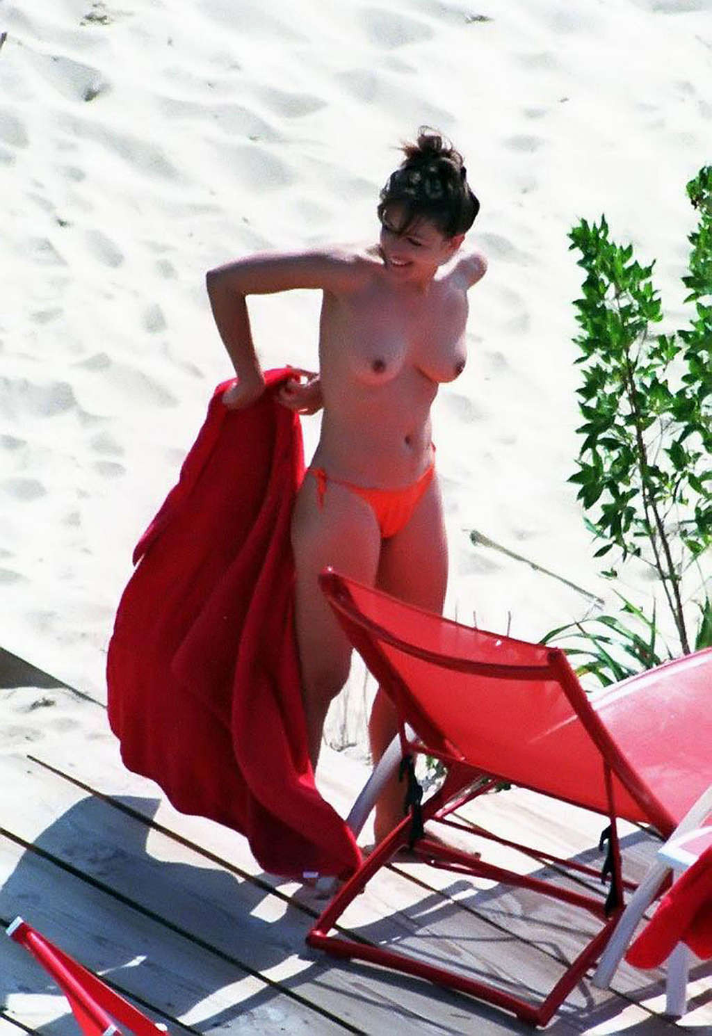 Elizabeth Hurley leggy in mini skirt and topless on beach #75349327