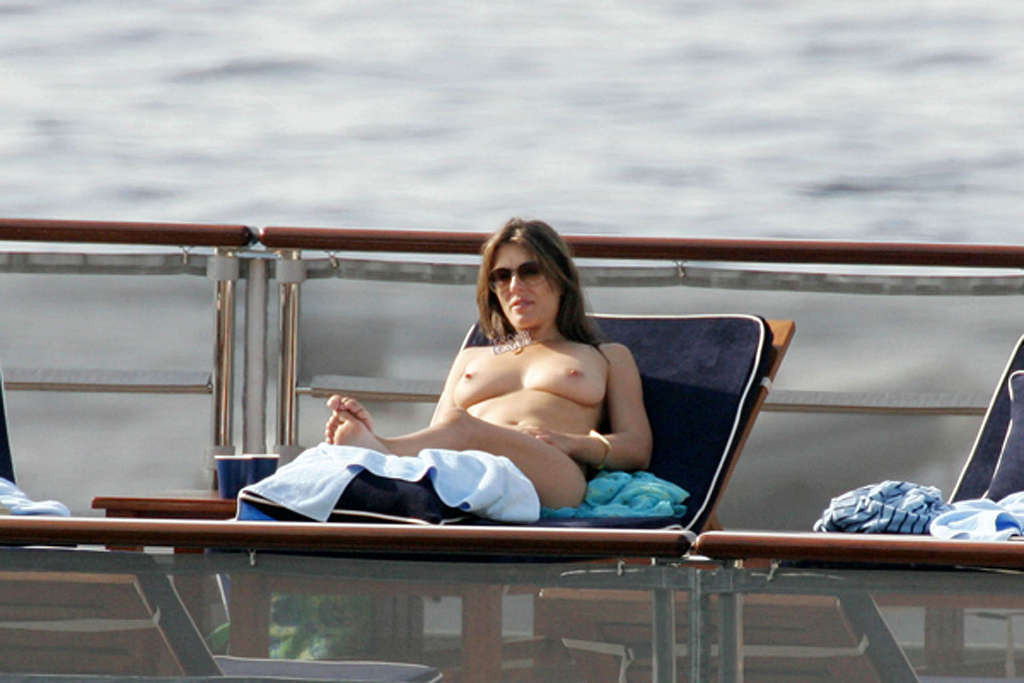 Elizabeth Hurley leggy in mini skirt and topless on beach #75349351