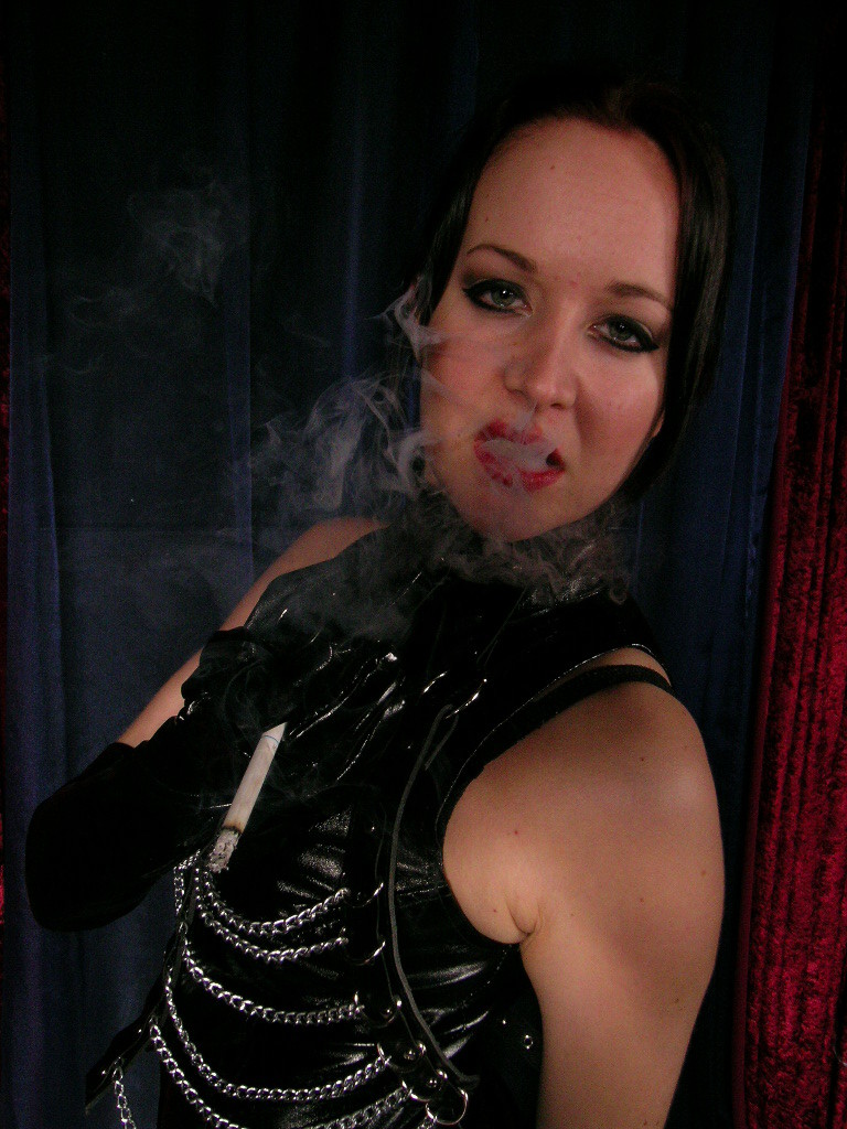 Sexy hot mistress wearing only leather smokes long cigarette
 #74905140