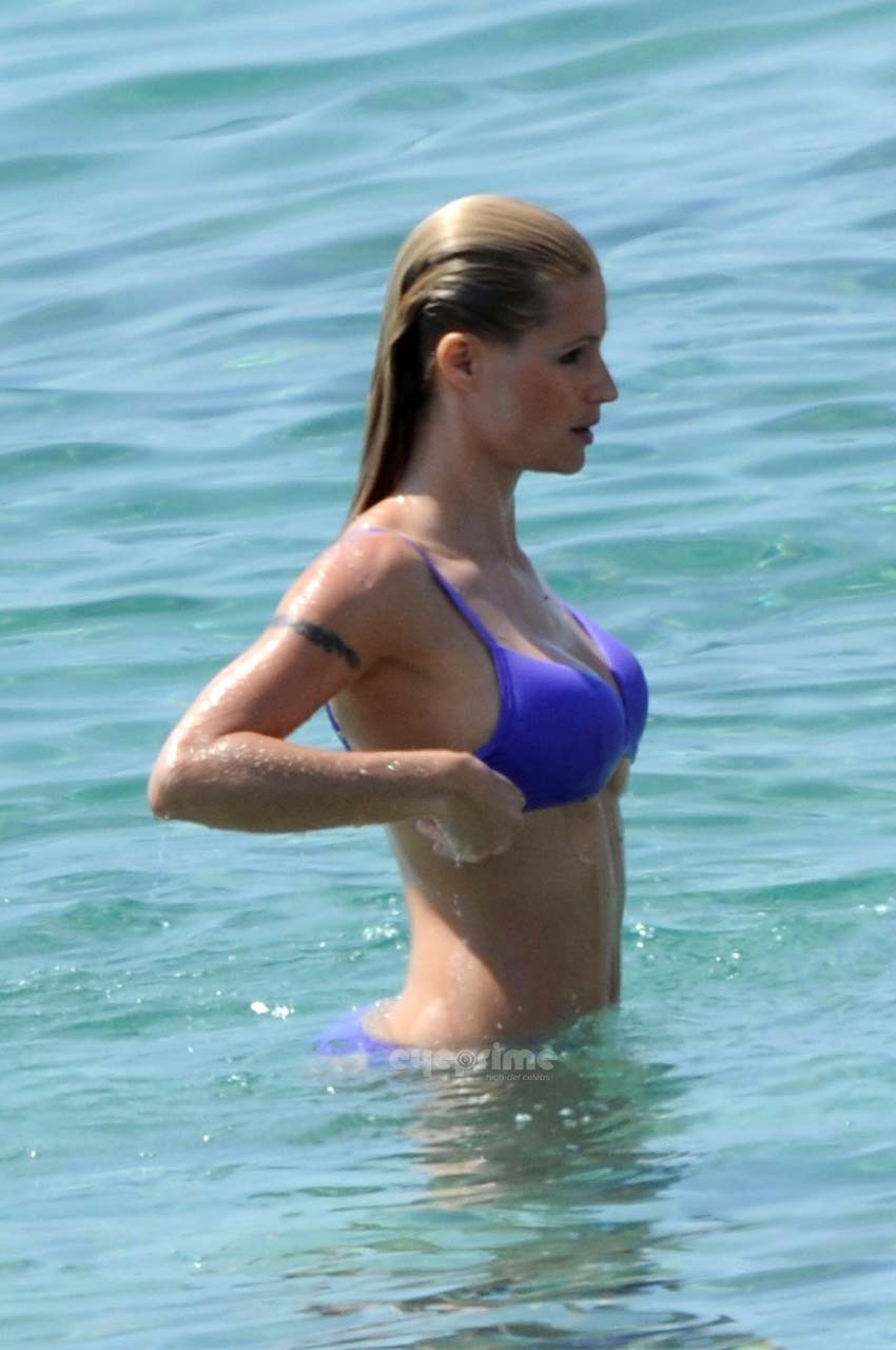 Michelle Hunziker looking very sexy in blue bikini on beach paparazzi pictures #75303644