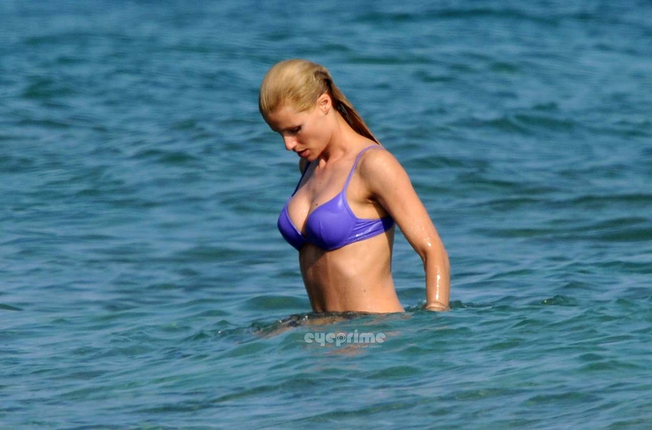 Michelle Hunziker looking very sexy in blue bikini on beach paparazzi pictures #75303660