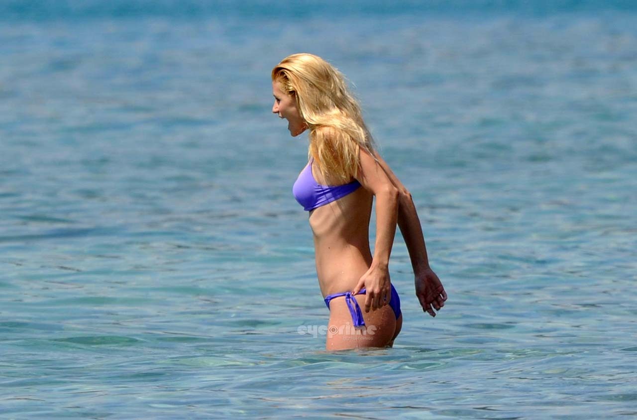 Michelle Hunziker looking very sexy in blue bikini on beach paparazzi pictures #75303671