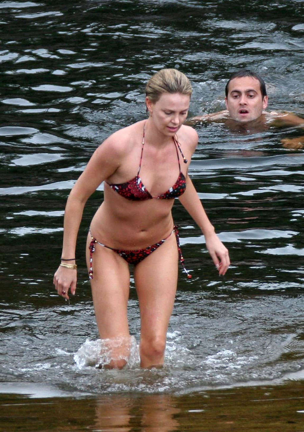 Charlize Theron showing tits on the beach and extremely hot body paparazzi pictu #75377226