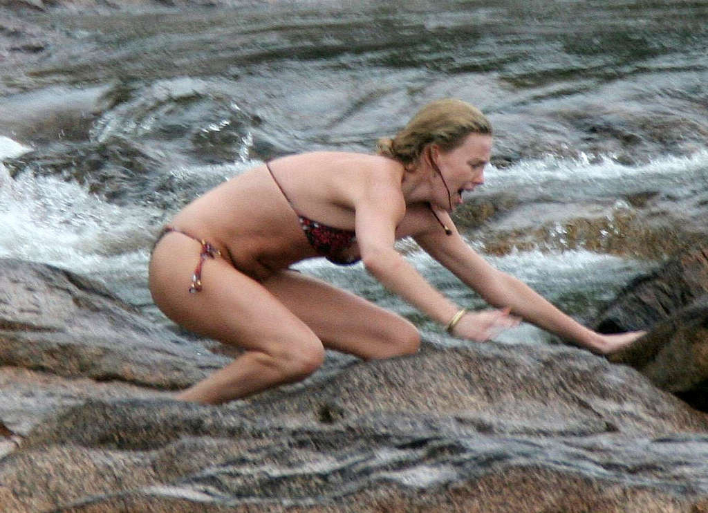 Charlize Theron showing tits on the beach and extremely hot body paparazzi pictu #75377264