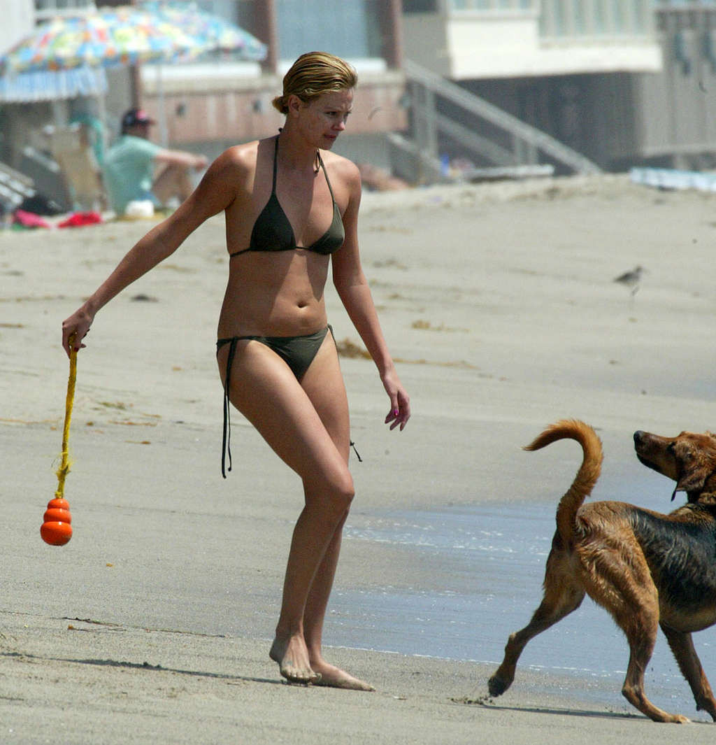 Charlize Theron showing tits on the beach and extremely hot body paparazzi pictu #75377269