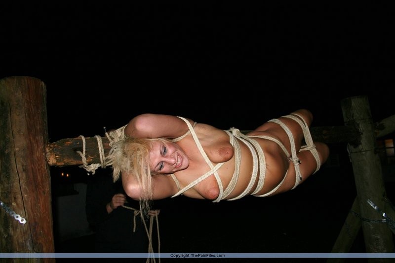 Blonde slave gets tied up to a stick #71869209