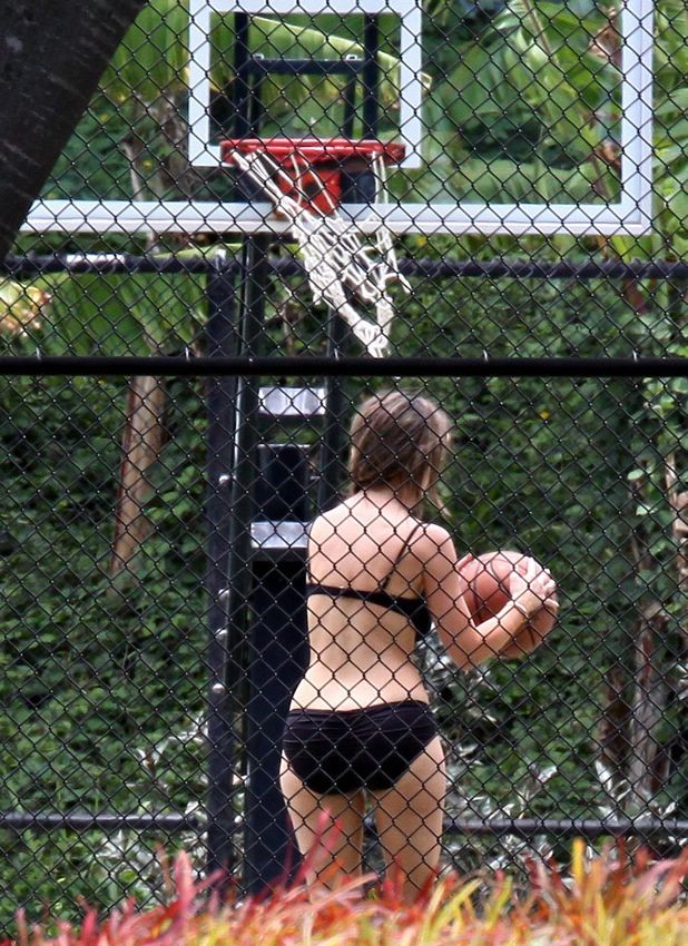 Jennifer Love Hewitt playing tennis in the tiniest of bikinis