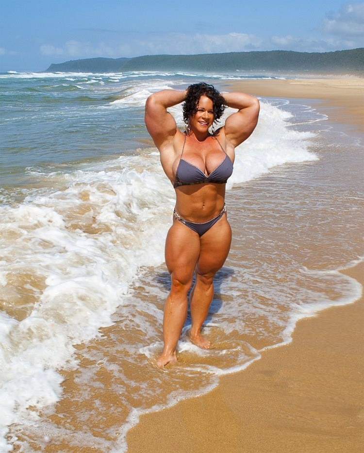 Massive female bodybuilder flexing her truly huge muscles #72258170